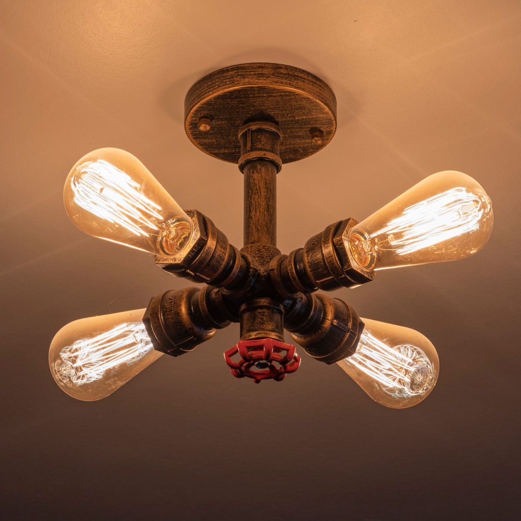 Industrial pipe ceiling light with four filament bulbs, the Log Room at the Feversham Arms, Helmsley