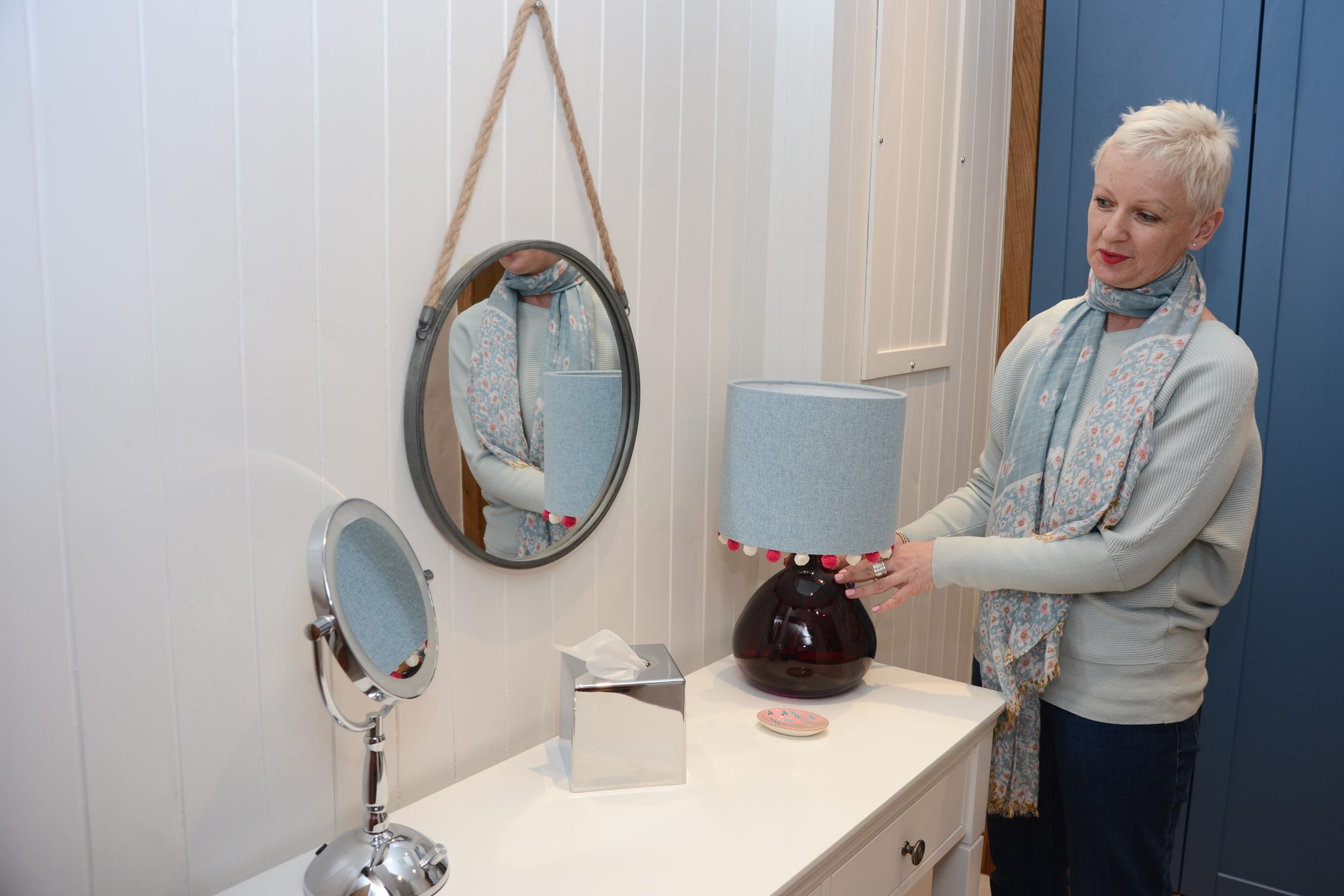 Pip, interior designer and project manager, styling a bedroom in a Yorkshire hotel
