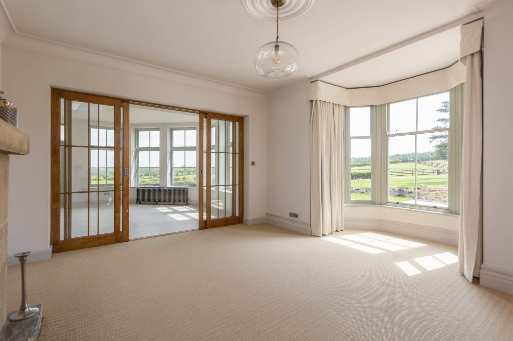 Sitting room with garden doors at The Old Rectory